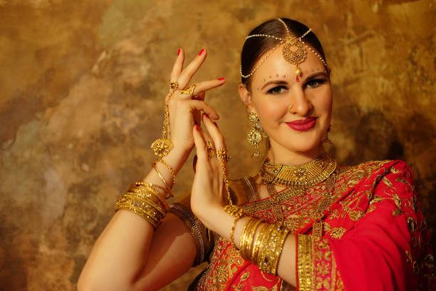istock Beautiful indian woman dancer in red sari. 1586035182
