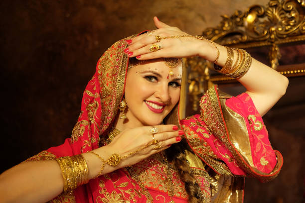 Beautiful indian woman dancer in the posture of Indian dance. stock photo