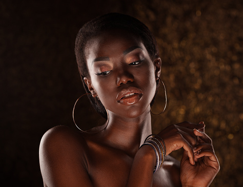 Beautiful black woman posing in a studio. Close up.