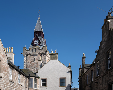 1 August 2023. Nairn,Scotland. This is the Nairn Town Hall Clock Tower on a sunny summer day with blue sky.