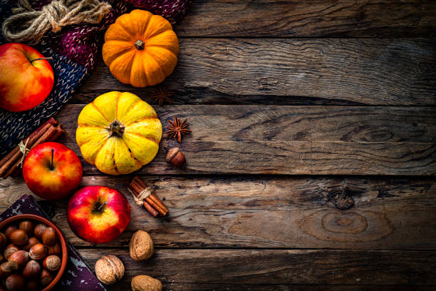 istock Autumn or Thanksgiving decoration border on rustic wood table. Copy space 1586061626