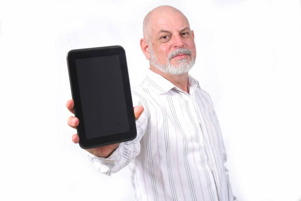 Hand holding tablet with blank screen