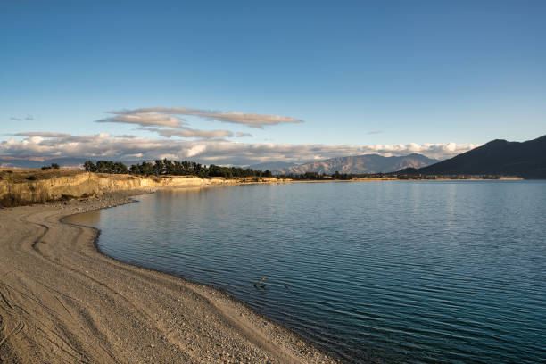 istock Mountain range and lake hore scenery around Lake Hawea 1586150330