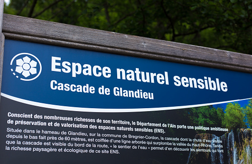 Glandieu (Ain), France: An information sign at the Glandieu Waterfall (Cascade de Glandieu).\nFamous for its waterfall, Glandieu is about 40 km west of Chambéry in the department of Ain.