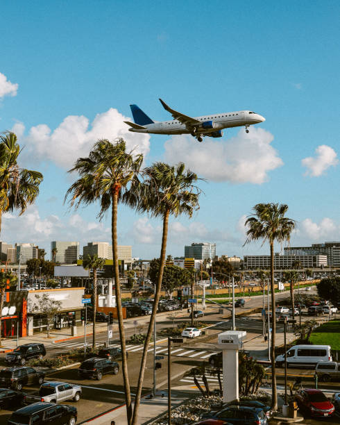istock Plane flying over Los Angeles, California 1586169883