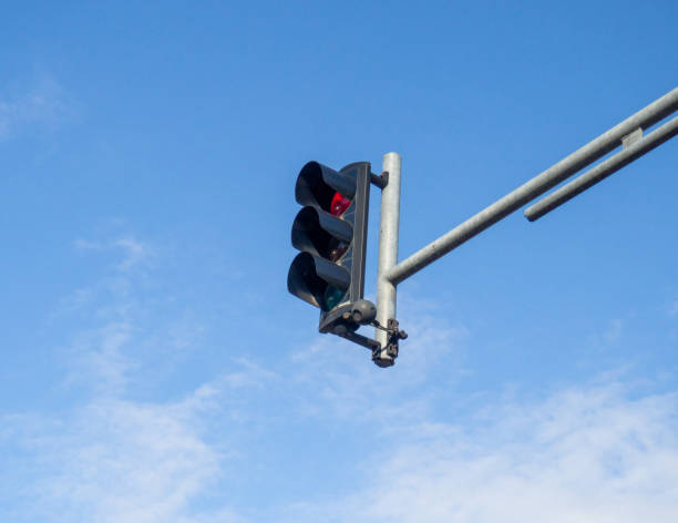 istock Traffic light against the sky. Red light.   Regulation of machine flows. 1586216688