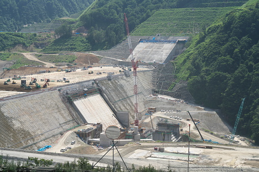 Akita, Japan - July 29, 2023: Concrete placement or concrete casting at construction of Naruse dam in Akita, Japan