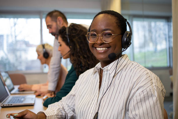 istock Call center operators working in the office 1586238206