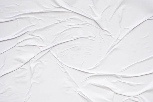 istock White blank crumpled and creased paper poster texture background 1586240318