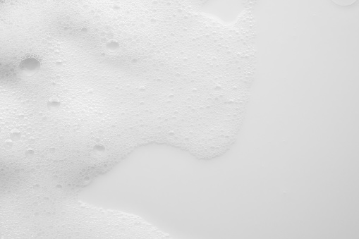 Abstract white soap foam bubbles texture on white background