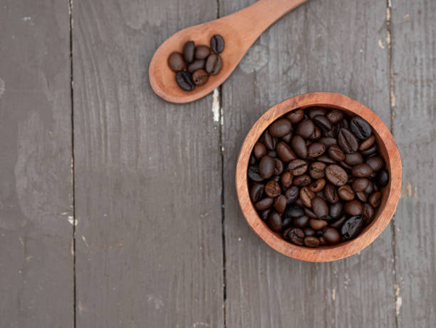 istock top view of coffee beans in wooden container 1586242118
