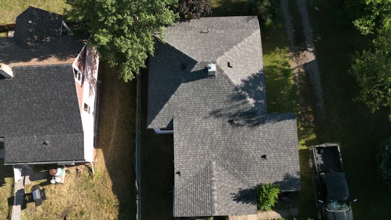 Aerial view of modest older home, in leafy community