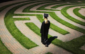Graduation Student Entering Maze Path Uncertain, Seeking Occupation, Employment, Goals