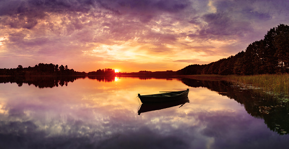 Fishing Boat on Lake during Colorful Sunset - HDR Panorama 