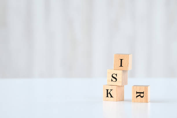 istock Collapsed wooden blocks with RISK word 1586389127