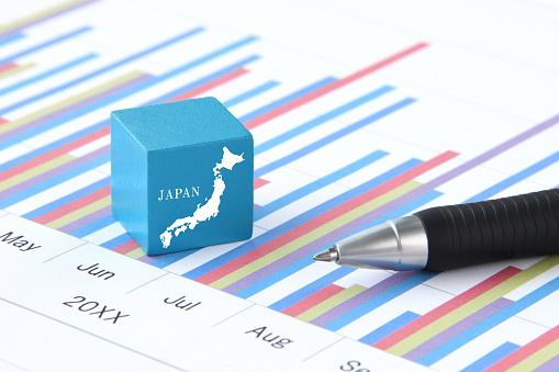 Wooden blocks with Japan map and business chart