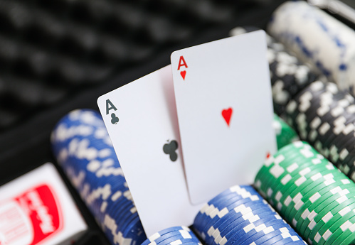 high-stakes-texas-holdem-poker-chips-and-cards-symbolize-risk-chance-and-adrenaline-in.jpg?s=170667a&w=0&k=20&c=pvJukX8gAgD0feI93iPxokMnxslHd8DjxgV9MUrdJLo=