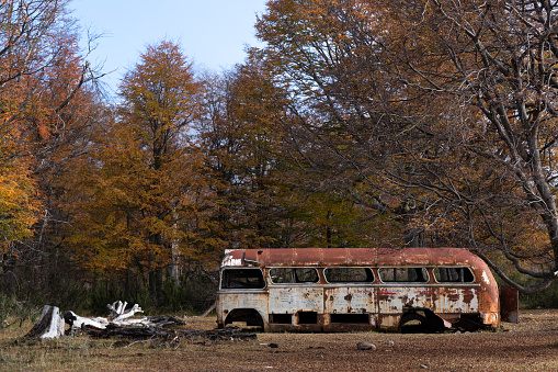 An abandoned bus near Reserva Baguilt in Patagonia during Autum in Trevelin, Chubut Province, Argentina