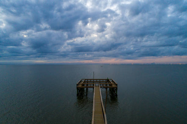 istock Pier at sunset on Mobile bay 1586454102