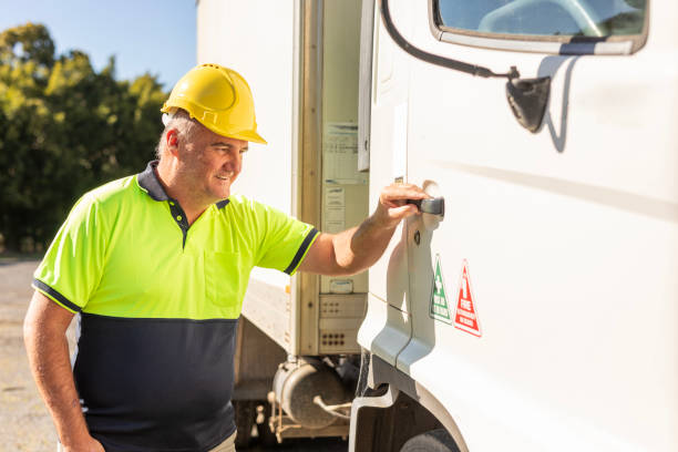 istock Middle aged man getting in a truck 1586513034