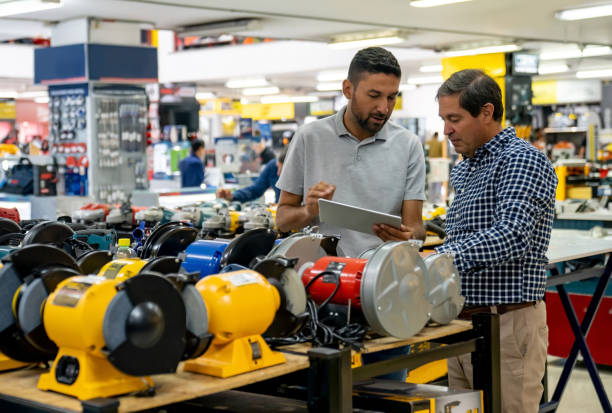 istock Retail clerk helping a man shopping at a hardware store 1586523959