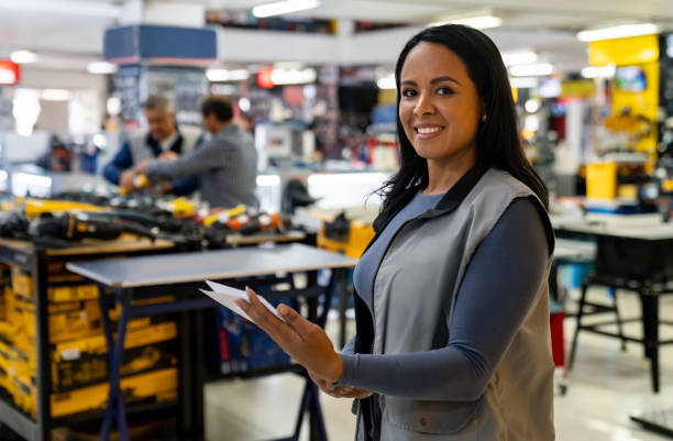 Happy saleswoman working at a hardware store