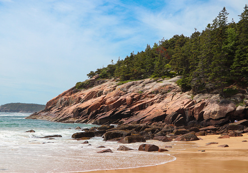 The rocky, granite cliffs at Sand Beach along the shore of Acadia National Park. Located near Bar Harbor, Maine.
