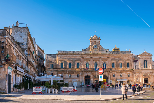 Ostuni, Italy - 31st Dec 2022: Piazza della Libertà with view of the Town Hall. On the right is the Church of San Francesco d'Assisi