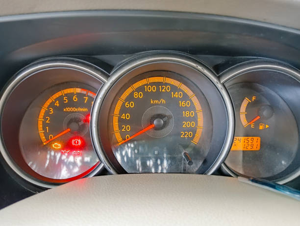 istock car interior details. Speedometer on dasboard. 1586565316