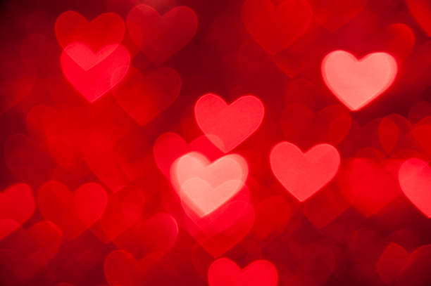 istock red bokeh of hearts background 158657909