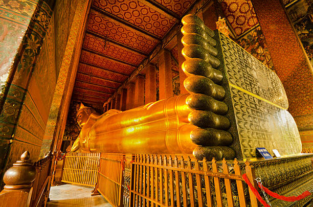 istock A side view of a reclining golden Buddha 158659056