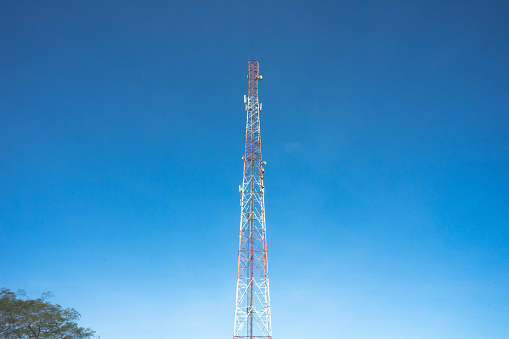 Telecommunication signal tower pole 4G 5G on clear blue sky on the background