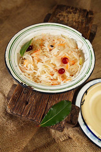 istock sauerkraut  Sour cabbage  old enamel bowl with bay leaves 158660176