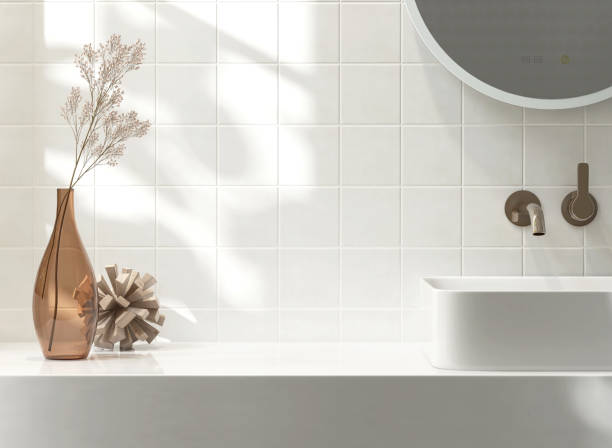 istock White vanity counter top, square wall tiles with ceramic washbasin, modern minimal style faucet, flower vase in bathroom in morning sunlight and shadow 1586605582