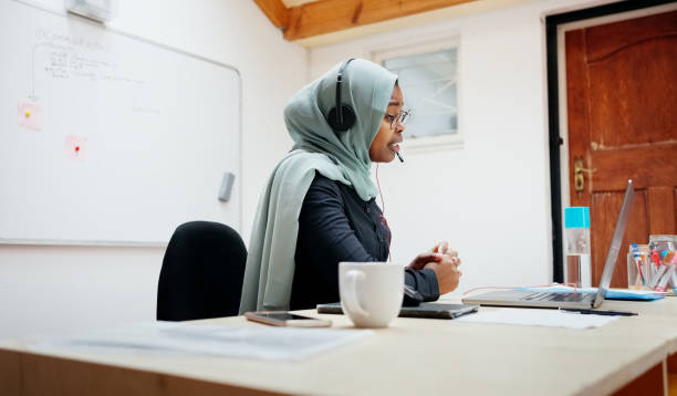 istock Islamic woman tutoring students online using a laptop 1586623380
