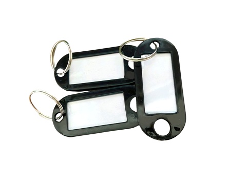 Hanger id tag black color plastic material with a white background