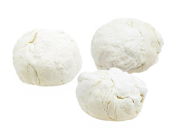 istock Three pieces of dough on a white 158664778
