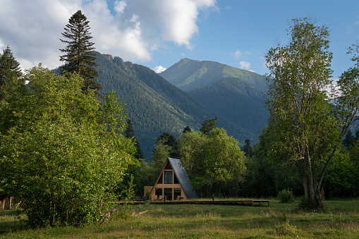 View of a detached chalet in the northern foothills of the Caucasus Mountains near the village of Arkhyz on a summer day, Karachay-Cherkessia, Russia