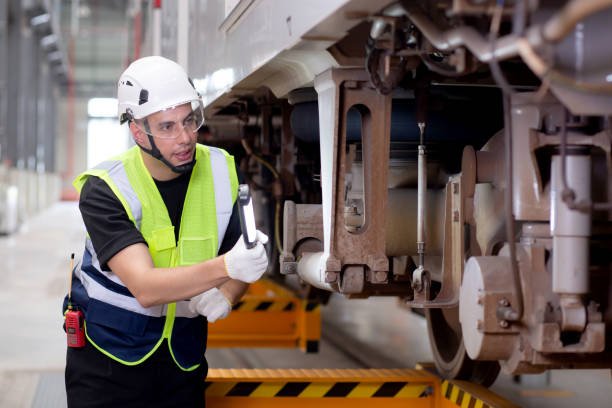 istock Young caucasian engineer man or worker looking and checking electric train for planning maintenance in station, transport and infrastructure, inspector or technician check and fix transport. 1586656882