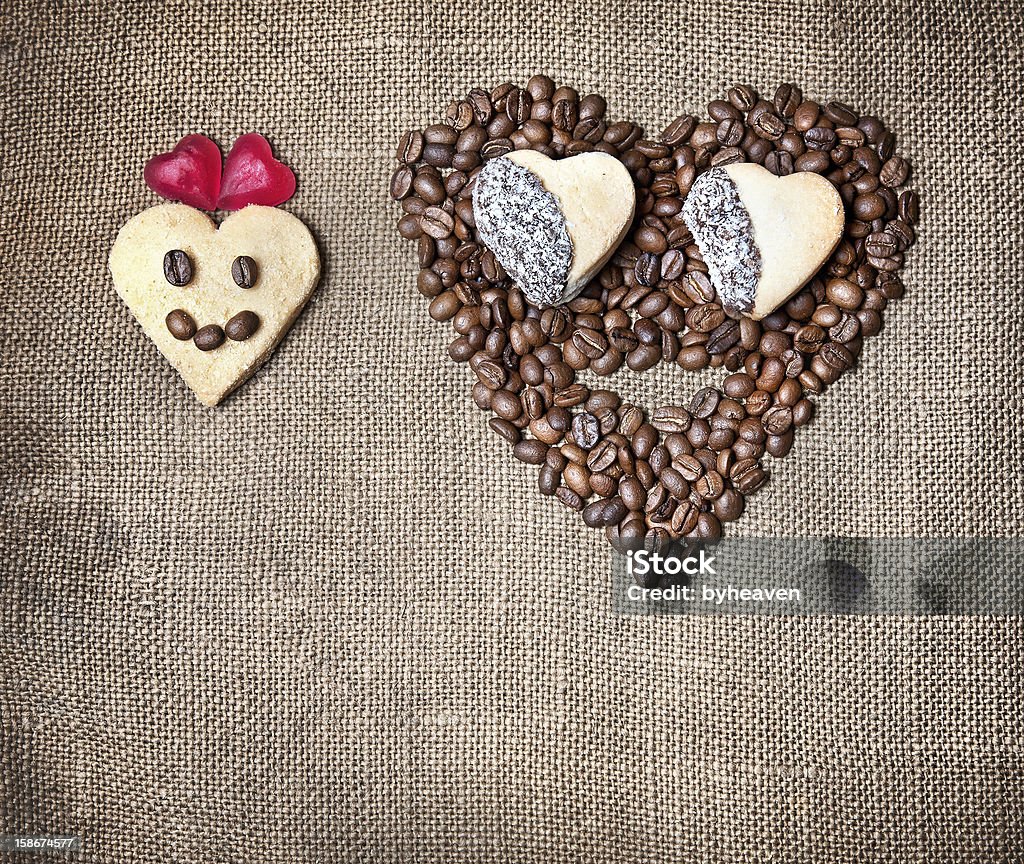 Funny Valentines day breakfast Funny Girl and boy from coffee beans, cookies and marmalades in shapes of heart on textured sack. Represent Valentines day Adult Stock Photo