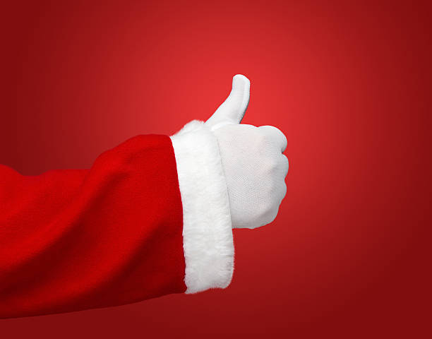 Thumbs up by Santa Claus stock photo