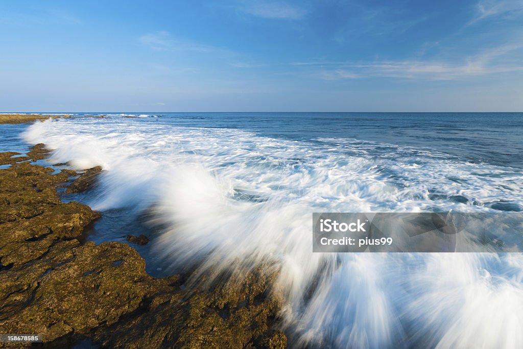 Waves Crashing Motion Blur Rocks Little Andaman Motion blurred waves crash over the rocks of the rocky coastline of rarely visited Little Andaman Island in the Andaman and Nicobar Islands of India Andaman Islands Stock Photo