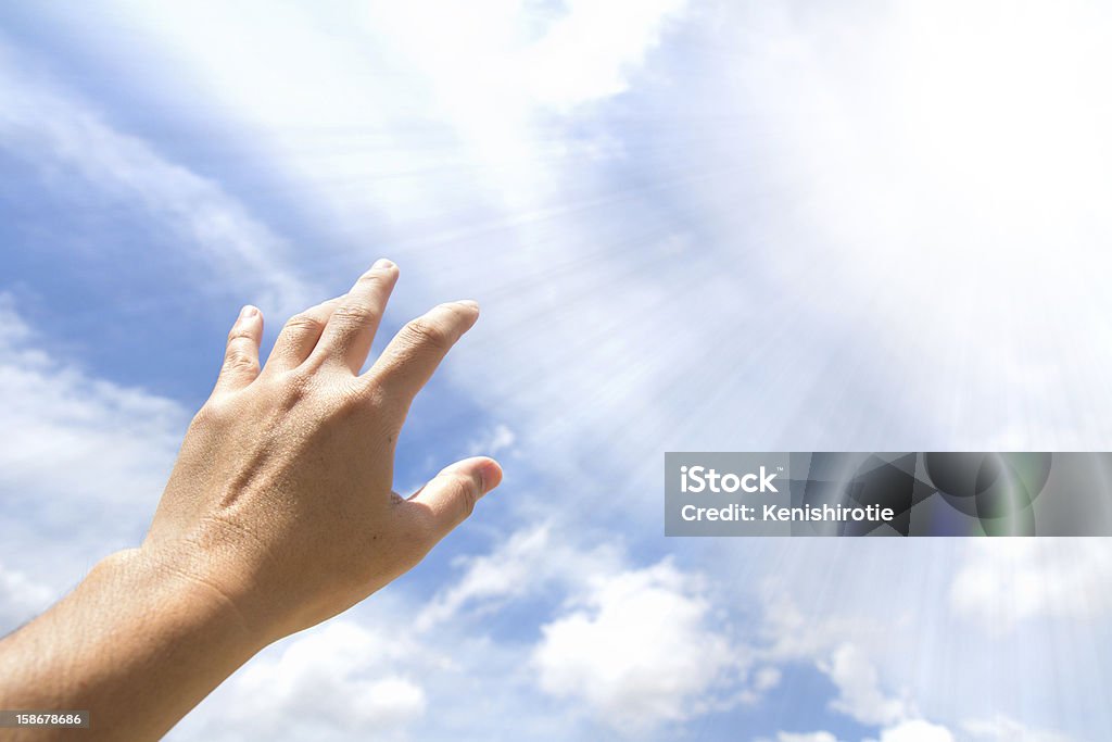 Hand reaching out Adult hand reaching out towards the sky Arms Outstretched Stock Photo