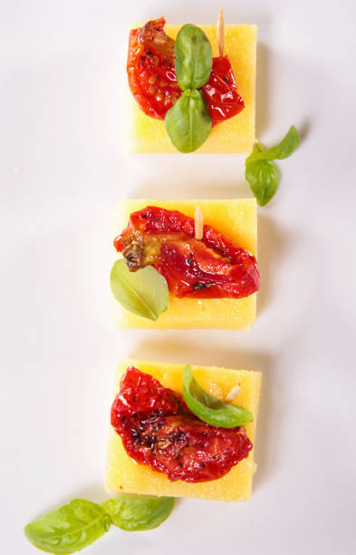 istock festive canape- polenta with dried tomato and basil 1586789632