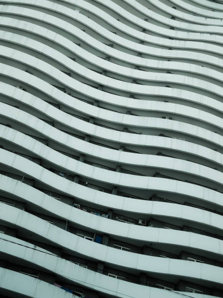 istock Modern multistory residential block with wavy design 1586812183