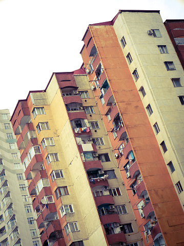 Old residential multistory building under the bright sunlight