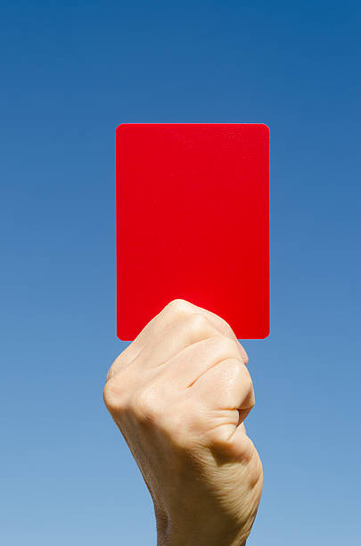 istock Red card in the hand again blue sky 158682619