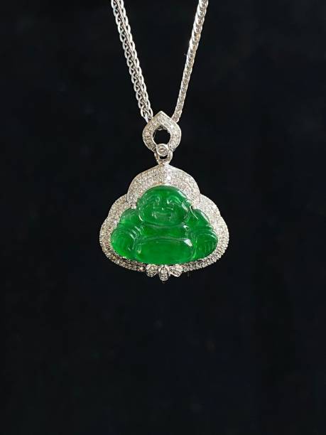 istock Exquisite pendant from sterling silver and set with an antique jade and diamond Buddha figure 1586855643