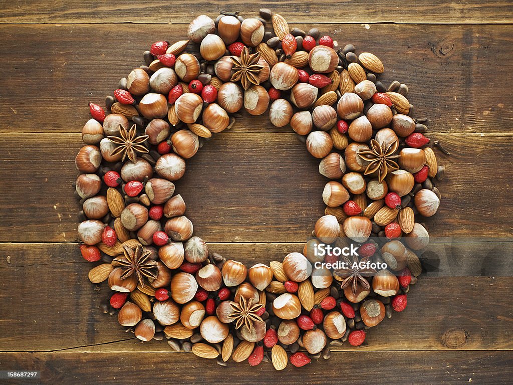 Christmas wreath Christmas wreath made of nuts and spices. Viewed from above. Almond Stock Photo