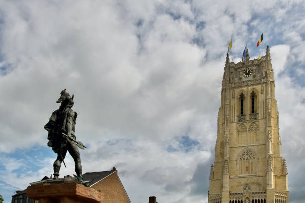 Statue of the gaulish Ambiorix with in front of him the basilica our lady of Tongeren in Limburg, Belgium